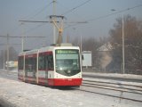 Inekon Tram on the snowy Street in Ostrava