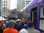 Seattle streetcar Grand Opening Day and crowd getting on.